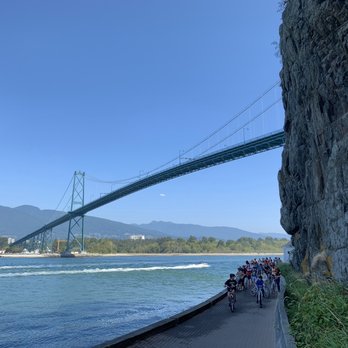 Stanley Park - Sea wall trail with cyclists under Lion's Gate bridge. - Parks Near Me - Vancouver, British Columbia Stanley Park - Sea wall trail with cyclists under Lion's Gate bridge. - Parks Near Me - Vancouver, British Columbia