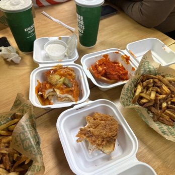 Wingstop - a variety of food items on a table - Chicken Wings Near Me - Watsonville, California Wingstop - a variety of food items on a table - Chicken Wings Near Me - Watsonville, California