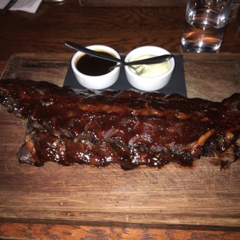 De Nachtwacht - Spare ribs. Comes with garlic sauce and some type of BBQ sauce, but they were marinated to perfection and didn't need sauce. - Steakhouses Near Me - Amsterdam, New Hampshire De Nachtwacht - Spare ribs. Comes with garlic sauce and some type of BBQ sauce, but they were marinated to perfection and didn't need sauce. - Steakhouses Near Me - Amsterdam, New Hampshire