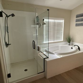 Armas Construction - "Before" photo of tub/shower which was previously "reglazed" white over the original mauve colored tile. - General Contractors Near Me - San Fernando, California