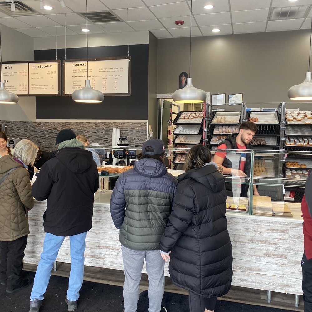 Doughnut - a group of people standing at a counter - Donuts Near Me - Woodridge, Illinois