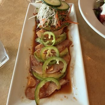 Yoshi's - Hamachi 'Crudo' -sliced yellowtail & avocado, jalapeño, fresh ginger, crispy garlic chips; warm ponzu - Jazz & Blues Near Me - Oakland, California
