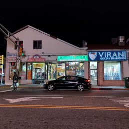 a car parked in front of a store a car parked in front of a store
