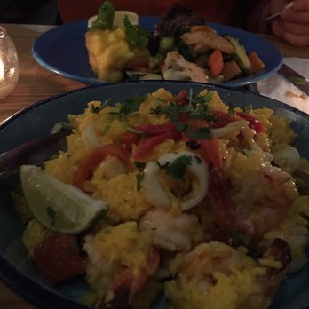 Valencia Cocina - Paella and Dijon painted salmon. Both meals were so delicious! - Latin American Near Me - Norwalk, Connecticut