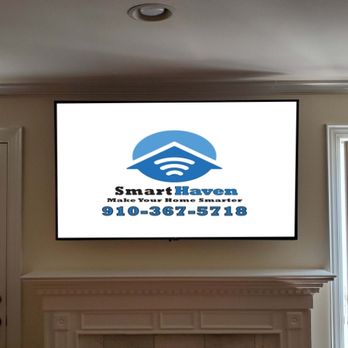 Smart Haven - Mounted TV over fireplace and relocated equipment to a closet. - Home Theatre Installation Near Me Smart Haven - Mounted TV over fireplace and relocated equipment to a closet. - Home Theatre Installation Near Me