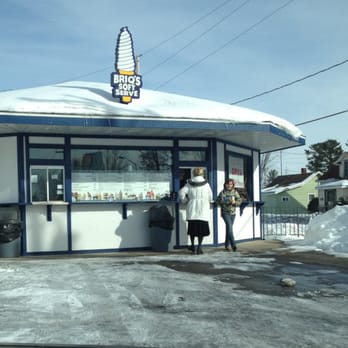 Briq's Soft Serve - a man and woman standing in front of a store - Ice Cream & Frozen Yogurt Near Me - Mosinee, Wisconsin