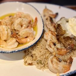 Red Lobster - Choose three shrimp. Two orders of Garlic Shrimp Scampi, one order of Grilled Shrimp over rice pilaf. Baked potato side.