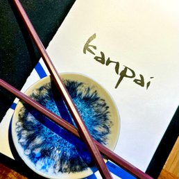 chopsticks and a bowl of food