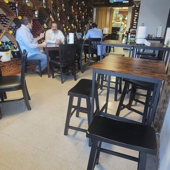 La Vasca Deli - a restaurant with tables and chairs - Delis Near Me - Miami, Florida
