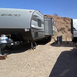 Would have to step over neighbors hoses to walk down side of our rv in our spot.