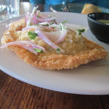 Puerto 27 Peruvian Kitchen & Pisco Bar - Beef empanadas: steak, onion, tomato, & soy sauce served in deep fried pockets of goodness with an aji verde aioli - Peruvian Near Me - Pacifica, California Puerto 27 Peruvian Kitchen & Pisco Bar - Beef empanadas: steak, onion, tomato, & soy sauce served in deep fried pockets of goodness with an aji verde aioli - Peruvian Near Me - Pacifica, California