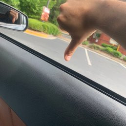 a person's hand in a car window