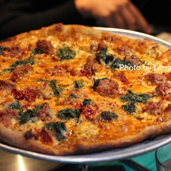 Nick's Restaurant and Bar - Local Sausage Pizza ($19.50) - Italian sausage, peperonata, spicy Calabrese chiles, fontina cheese, herbed goat cheese, spinach - Bars Near Me - Fort Collins, Colorado Nick's Restaurant and Bar - Local Sausage Pizza ($19.50) - Italian sausage, peperonata, spicy Calabrese chiles, fontina cheese, herbed goat cheese, spinach - Bars Near Me - Fort Collins, Colorado