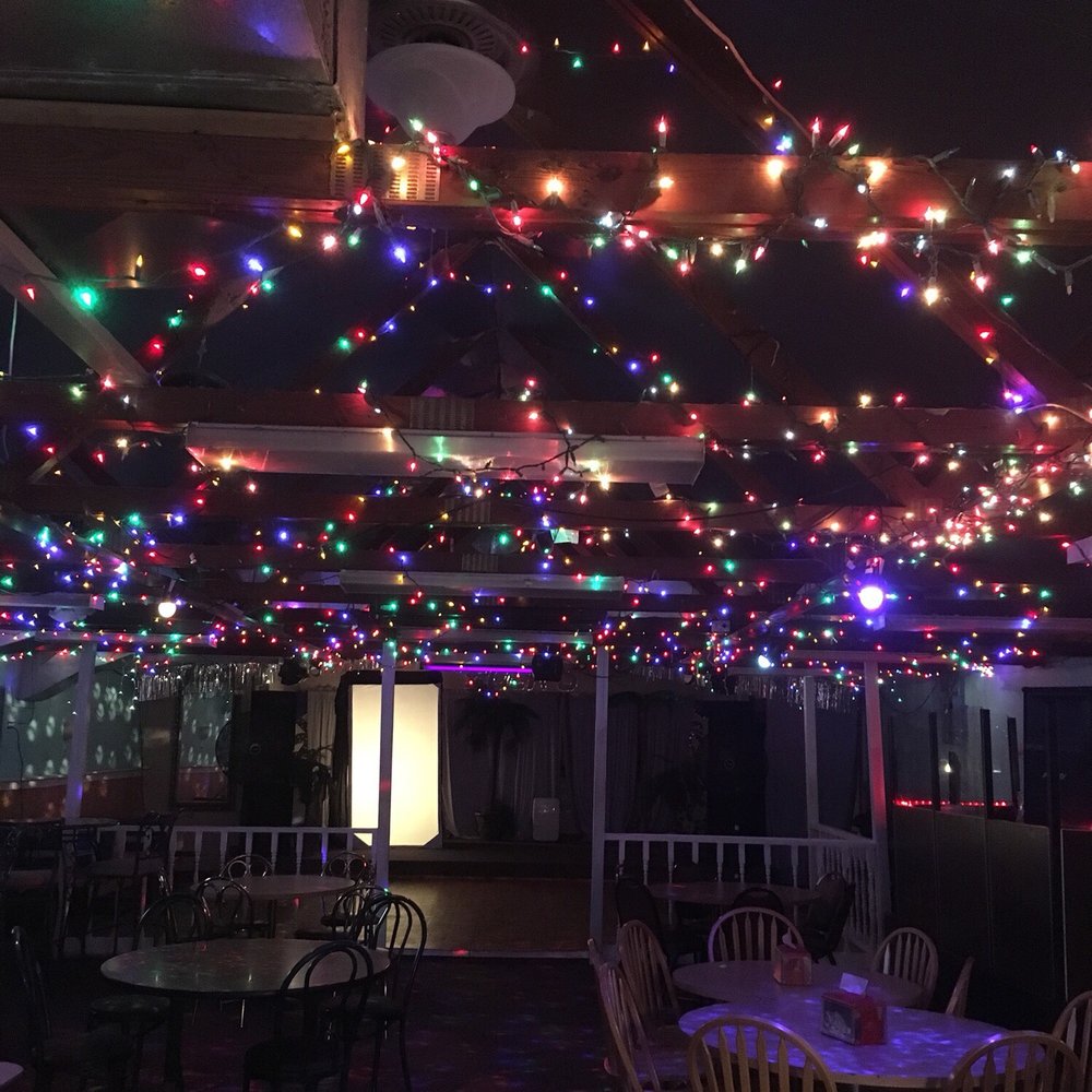 a restaurant decorated with christmas lights a restaurant decorated with christmas lights
