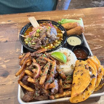 Cris and John - Birria taco platter with saltado, egg rolls, and pho - Vietnamese Near Me - Dallas, Texas
