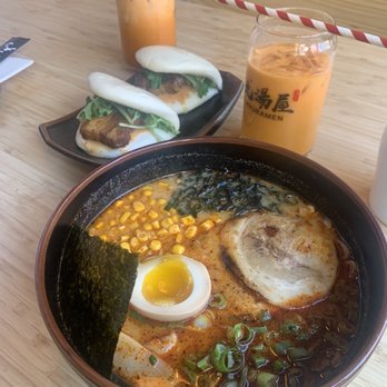 Kyuramen - Flushing - #6. Kyushu Spicy Tonkotsu Ramen Steam Pork Bao Buns Thai Iced Tea (22oz) - Ramen Near Me - Flushing, New York