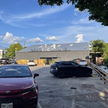 Space Cowboy - Outside. They have a private lot for customers - Cocktail Bars Near Me - Austin, Texas