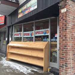 Fruiterie Natura - Storefront after close - usually covered in fresh fruit and veg.