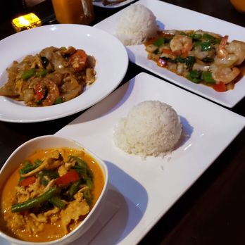 Nur Thai - left to right: panang curry with chicken, drunken noodles with chicken, spicy basil with shrimp - Thai Near Me - Park, New York Nur Thai - left to right: panang curry with chicken, drunken noodles with chicken, spicy basil with shrimp - Thai Near Me - Park, New York