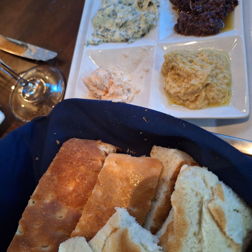 Fins At Sharky's - Bread basket and assorted toppings - Steakhouses Near Me - Venice, Florida Fins At Sharky's - Bread basket and assorted toppings - Steakhouses Near Me - Venice, Florida