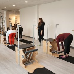 Symmetry Pilates - The Wunda Chair classes taught by Kerri are awesome!