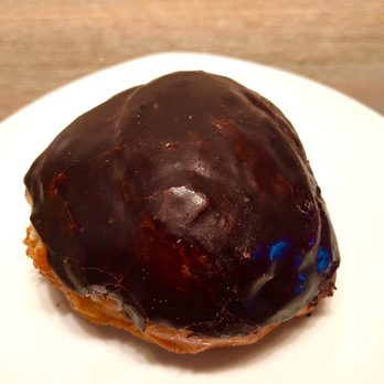 Scotts Donuts & Cafe - Cream-Filled Chocolate-Iced. Raised donut is infused with vanilla custard cream and topped with a chocolate frosting. - Bakeries Near Me - Mission Viejo, California Scotts Donuts & Cafe - Cream-Filled Chocolate-Iced. Raised donut is infused with vanilla custard cream and topped with a chocolate frosting. - Bakeries Near Me - Mission Viejo, California