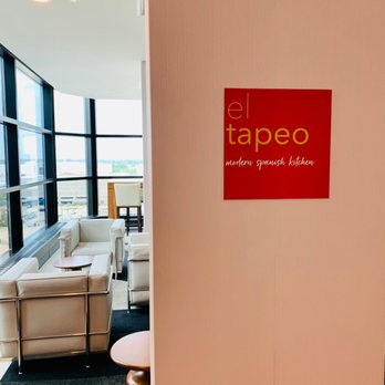 El Tapeo Modern Spanish Kitchen - a view of a living room with a couch and a coffee table - Tapas/Small Plates Near Me - Oak Brook, Illinois