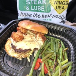 Quaker Steak & Lube - Garlic Cheese curd parm burger with green beans. So good!