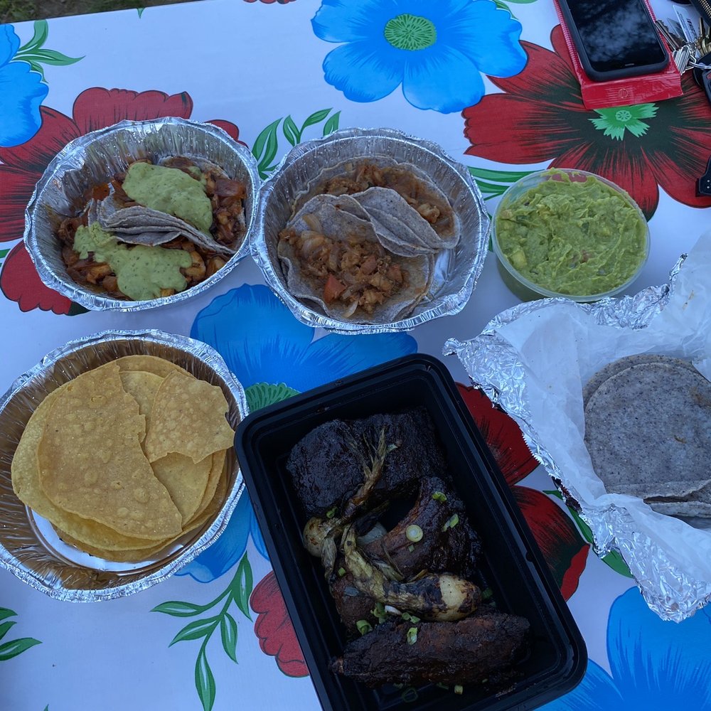 Clockwise from top left: shrimp tacos, octopus tacos, guac, tortillas, rib carnitas, tortillas
