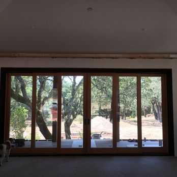 Caldwell Builders Group - a view of the outside of a house through a sliding glass door - General Contractors Near Me - Sebastopol, California Caldwell Builders Group - a view of the outside of a house through a sliding glass door - General Contractors Near Me - Sebastopol, California