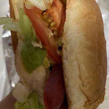 Los Chichos - a person holding a hot dog - Food Trucks Near Me - El Paso, Texas