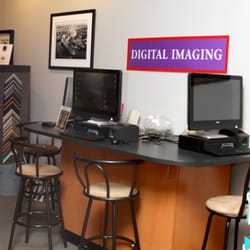 Motophoto - Our kiosk bar. Plug in your smart phone or digital camera media and edit and order prints, books and gifts.