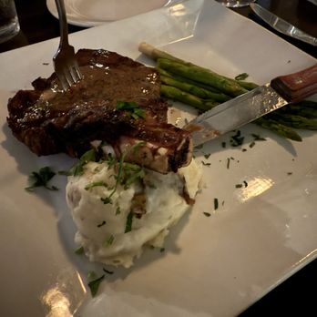 M Restaurant - Bone-in ribeye steak, with asparagus spears and garlic roasted mashed potatoes - Italian Near Me - Avalon, California