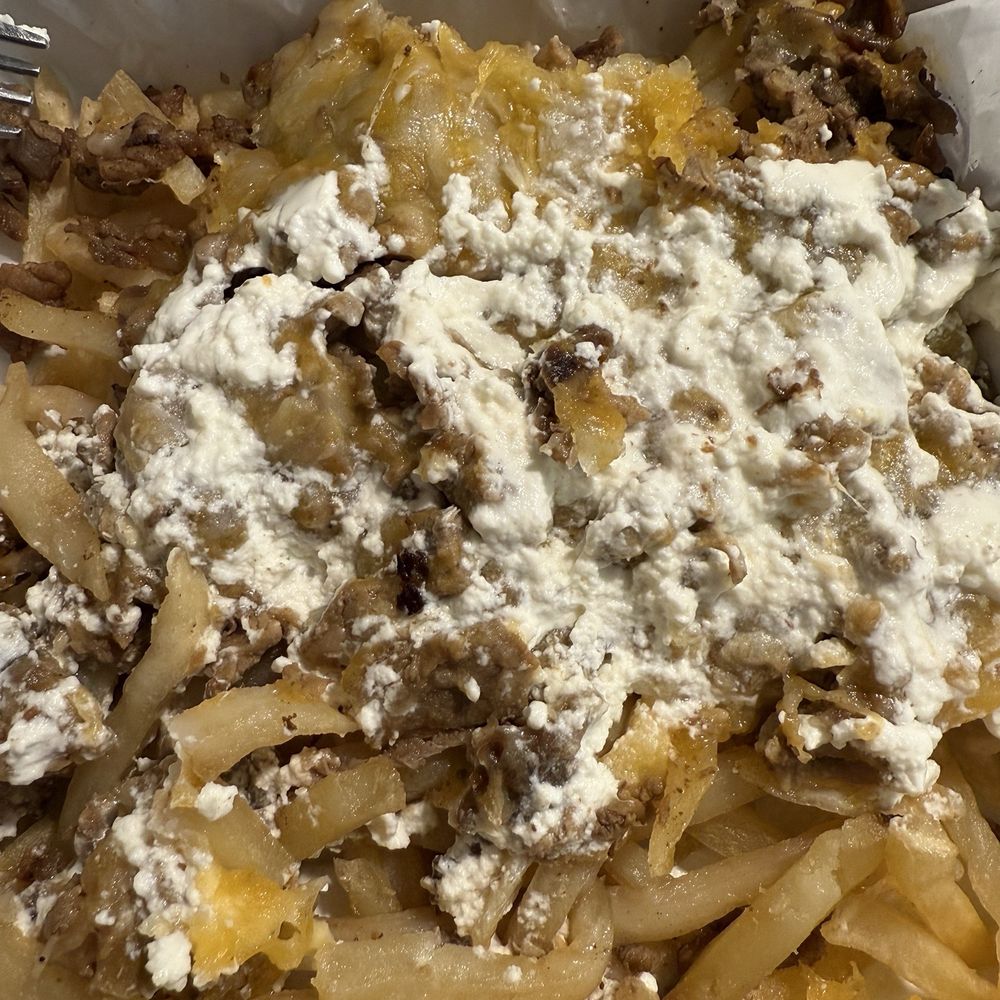 This is the curdled sour cream on the fries after a majority of it was removed This is the curdled sour cream on the fries after a majority of it was removed