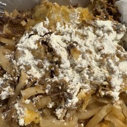 This is the curdled sour cream on the fries after a majority of it was removed