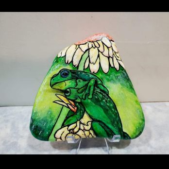 Reynolds Acrylic Arts - Froggies in love, Froggies in the rain under a flower umbrella. Hand painted on an imported Santorini Stone. - Paint & Sip Near Me Reynolds Acrylic Arts - Froggies in love, Froggies in the rain under a flower umbrella. Hand painted on an imported Santorini Stone. - Paint & Sip Near Me