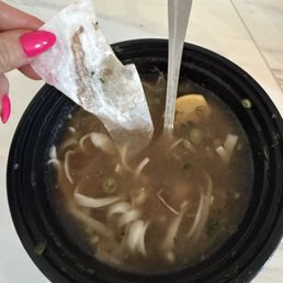 Large piece of paper in the pho soup. Large piece of paper in the pho soup.