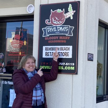 Devil Daves Bloody Mary Shop - a woman leaning against a sign - Herbs & Spices Near Me - Rehoboth Beach, Delaware Devil Daves Bloody Mary Shop - a woman leaning against a sign - Herbs & Spices Near Me - Rehoboth Beach, Delaware