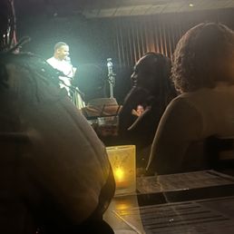 Orders all placed! Main act on stage... the table directly in front of us has drinks