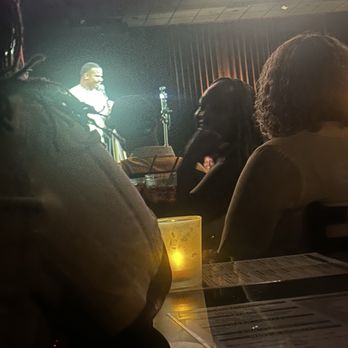 Funny Bone Comedy Club & Restaurant - Orders all placed! Main act on stage... the table directly in front of us has drinks - Bars Near Me - Albany, New York