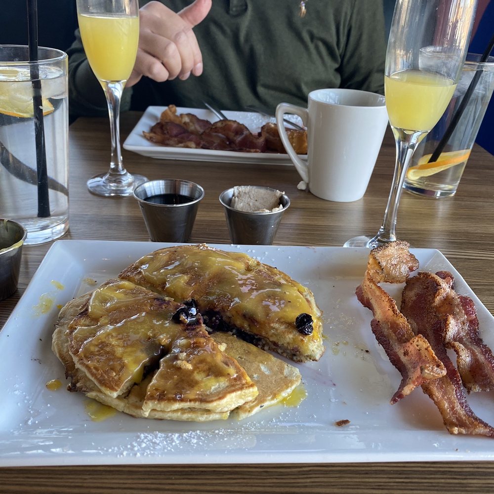 Crave Kitchen & Bar - Blueberry Pancakes w/lemon curd & mimosas - American Near Me - El Paso, Texas Crave Kitchen & Bar - Blueberry Pancakes w/lemon curd & mimosas - American Near Me - El Paso, Texas