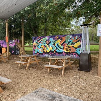 Taqueria El Camino - a group of picnic tables with graffiti on them - Latin American Near Me - Dover, Pennsylvania Taqueria El Camino - a group of picnic tables with graffiti on them - Latin American Near Me - Dover, Pennsylvania