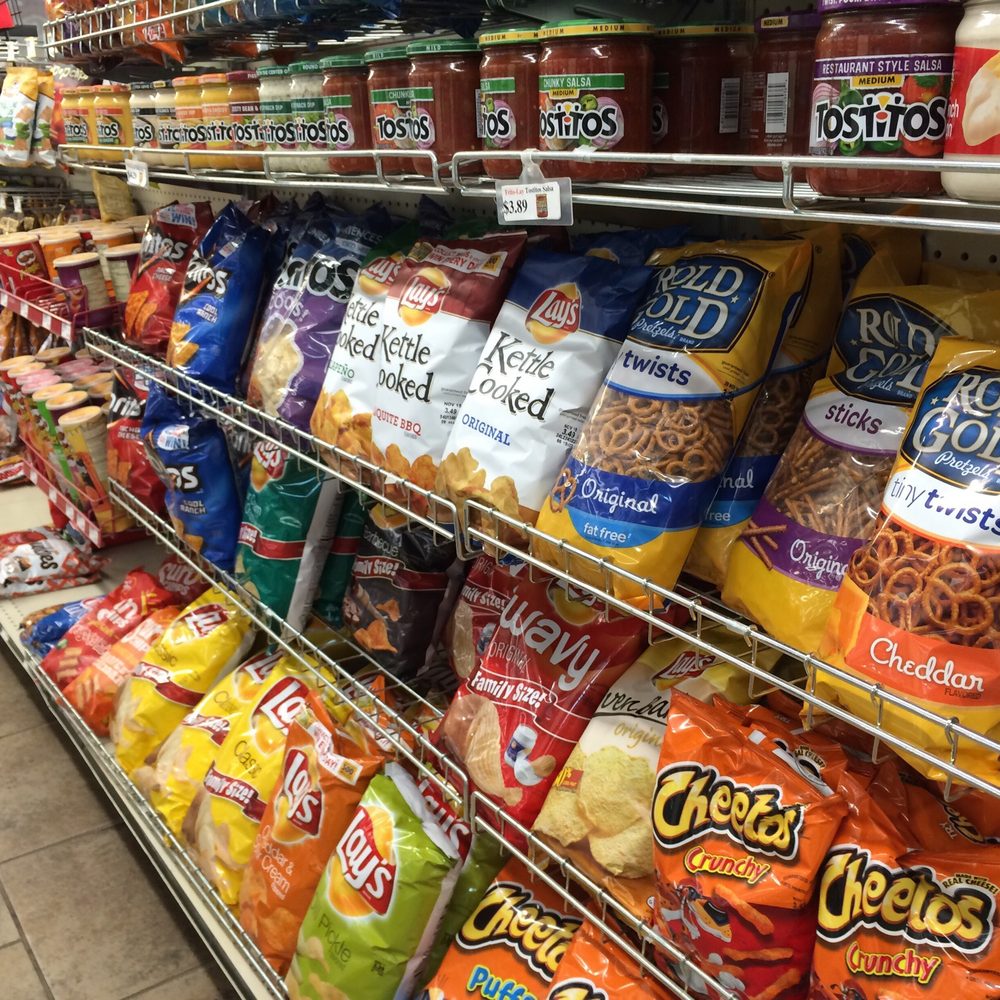 Casey's - a variety of snacks on display in a grocery store - Pizza Near Me - Oskaloosa, Iowa