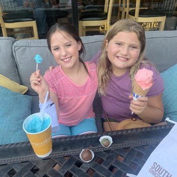 South Bend Chocolate Cafe - Strawberry waffle cone and blue moon in a cup - Chocolatiers & Shops Near Me - South Bend, Indiana South Bend Chocolate Cafe - Strawberry waffle cone and blue moon in a cup - Chocolatiers & Shops Near Me - South Bend, Indiana