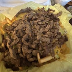 Senor Pancho Fresh Mexican Grill - Carne Asada Fries (nacho cheese and sour cream on the side). Heavy on the meat and cheese. Love ettt