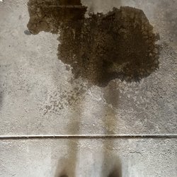 Tuffy Tire & Auto Service Center - Oil puddle - it doesn't look like a puddle but it is!!!