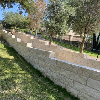 Garden Experts - Completed retaining wall for a drainage solution, including sprinklers modifications in Westlake Hills, Austin, Tx - Landscaping Near Me