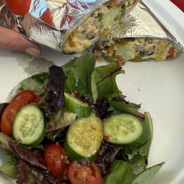 Breakfast wrap, scrambled eggs, bacon, veggies, fresh side salad, house sauces