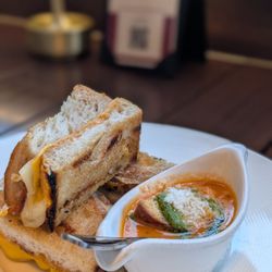 TOWN - Grilled cheese with a baby tomato soup for dipping. Part of the happy hour menu!