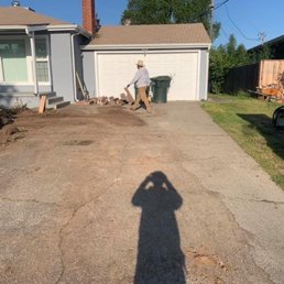 The driveway and the side of the house. New driveway will extend to the property line to be able to use for RV access. The driveway and the side of the house. New driveway will extend to the property line to be able to use for RV access.